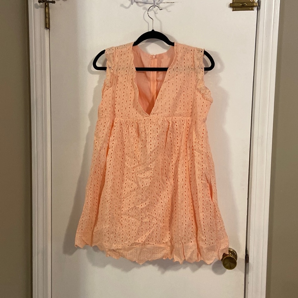 Peach sundress with built in shorts, pockets and back zipper. Size L